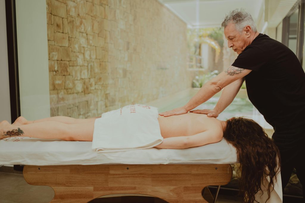 Professional massage therapist performing a relaxing spa treatment in a serene setting.