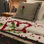 Elegant hotel room in Niğde with romantic rose petal arrangement. Ideal for couples seeking a special getaway.